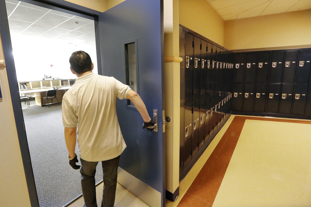 janitor opening a door inside a school