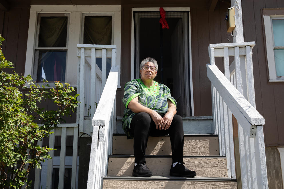 Antonette Blythe sits on her door stoop