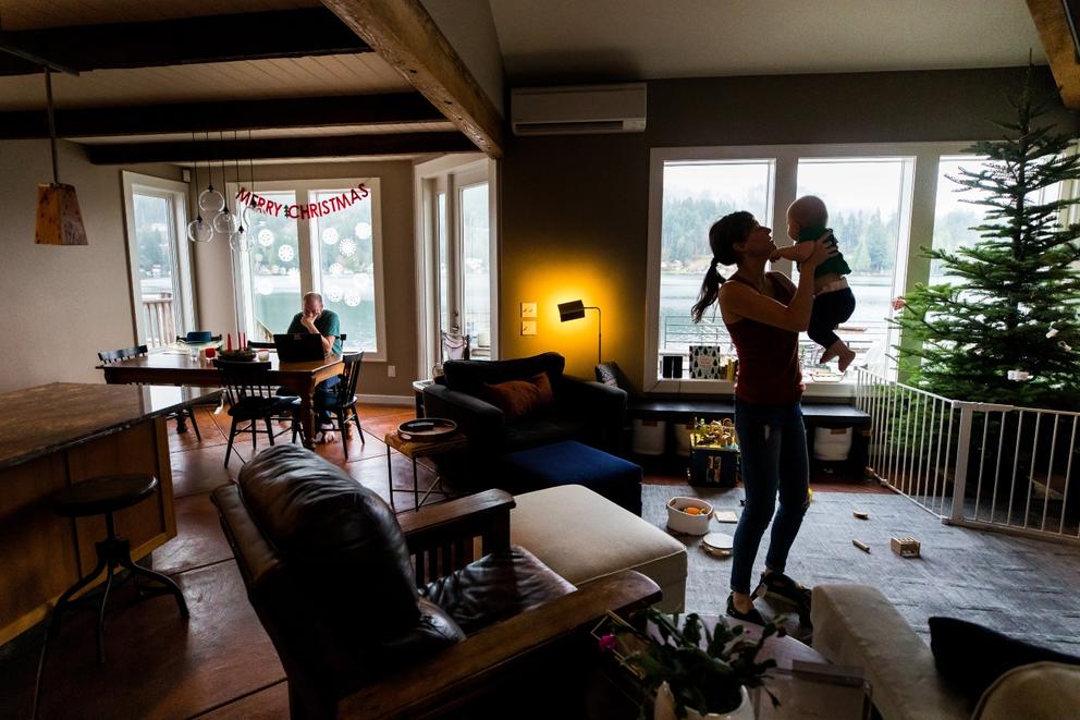 family in their living room in Summit Lake, Washington