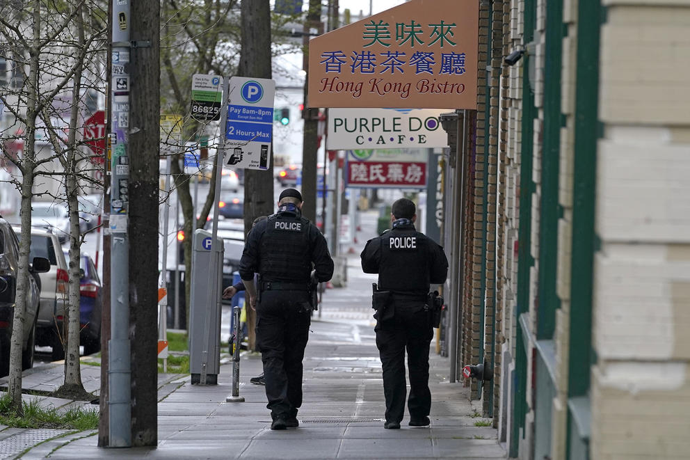 police walking down a sidewalk in Seattle