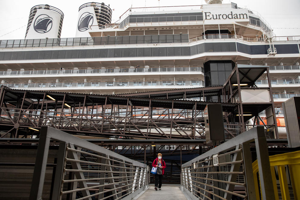 A cruise ship passenger disembarks