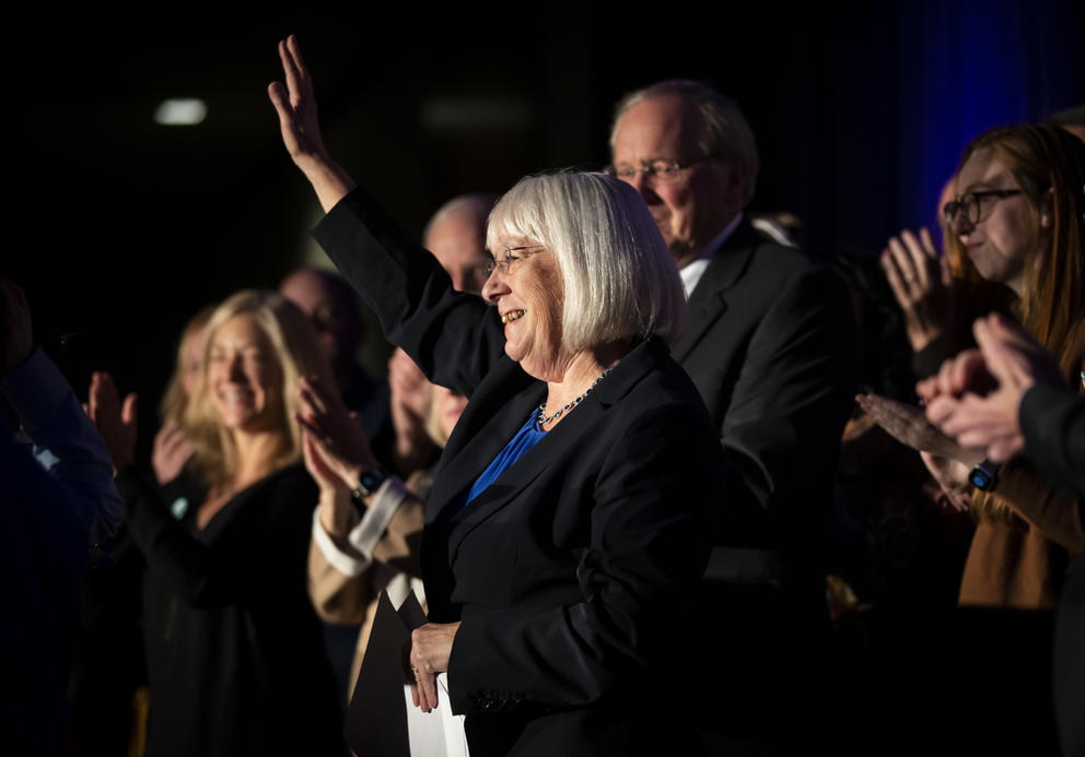 Patty Murray waves surrounded by family