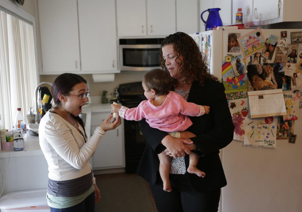 A mother with nanny and child