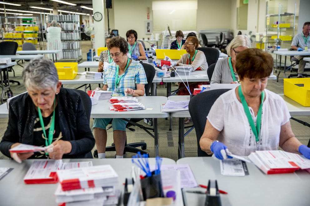 County election workers count primary ballots