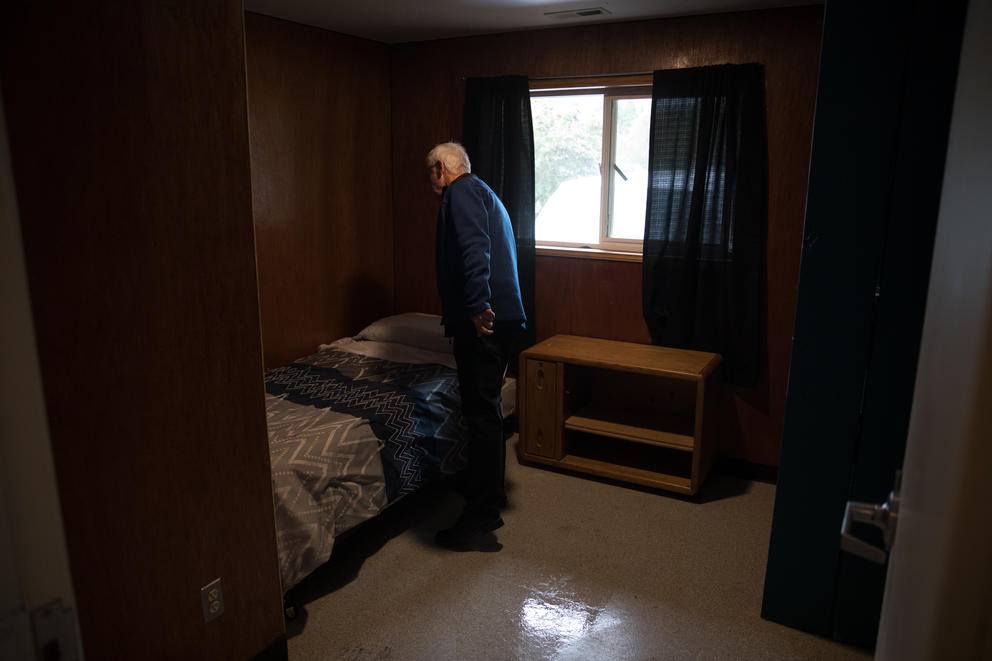 Secret Harbor President and CEO Brian Carroll tidies a bedroom inside of the organization's homes in Burlington, Washington