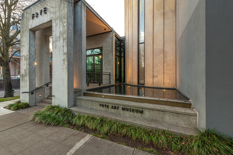 museum entrance featuring concrete and water feature