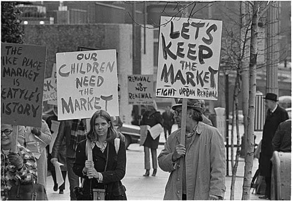 People with signs supporting Pike Place Market