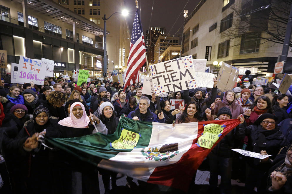 People cheer during a rally.