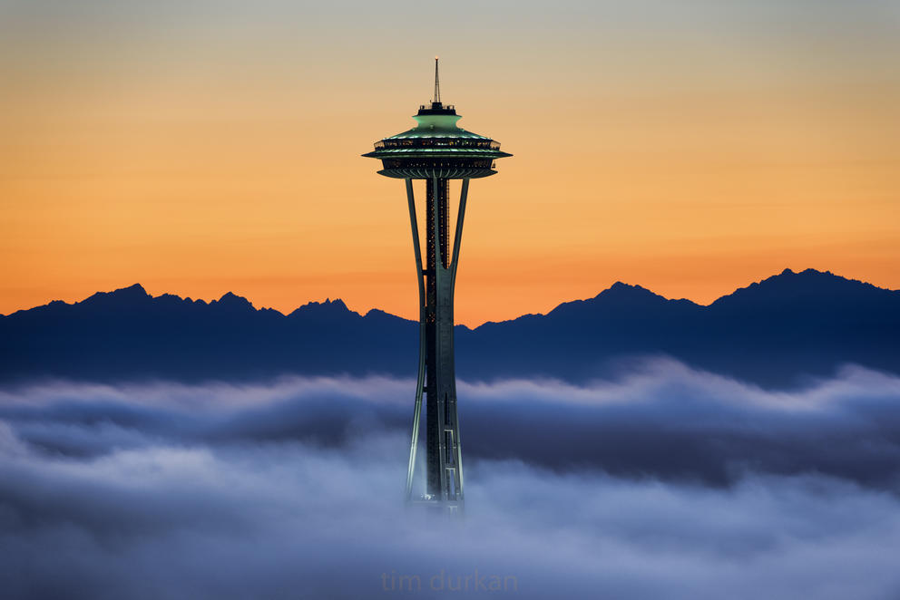 The Space Needle peeks through the fog layer. Credit: Tim Durkan <a href="https://www.flickr.com/photos/timdurkan/10460205174/in/photolist-gWkhz5-UguVim-hW1Qsf-6yfhmd-38zeBN-5U3Xk9-qxhA6y-qevbQB-7iwquK-8LXwgK-peZeKW-ApC4N-6RCiAA-3czzWL-dNeVUx-dP2SsR-Hf2WsQ-zGY5d-4Q9PNF-zH5Gj-HhYpNk-dMqutV-8M4D8Y-iKS5fy-fN8JAw-URuU6c-GnBdWt-Hf31QC-aRugU2-8mEZ4-h8ob8s-4CscBn-21quHp1-dMKUum-dNkvCU-iKU8rb-qJ2GEa-dNkvmG-dNQnf7-5EMWrV-3P59Aa-iKRYfs-dQxEpf-dNQnnN-qZRocf">via Flicker Creative Commons 2.0 Attribution</a>.