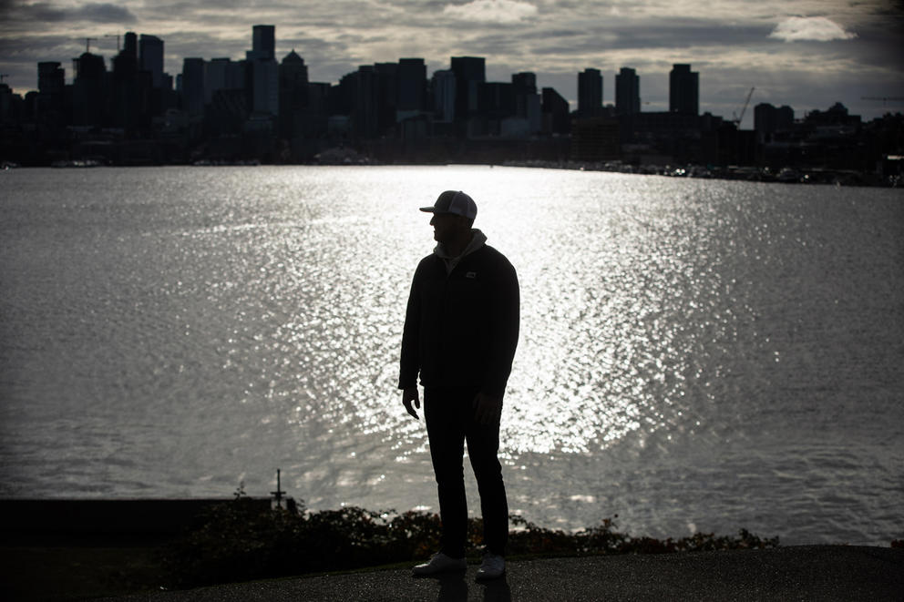 A person standing in front of the water