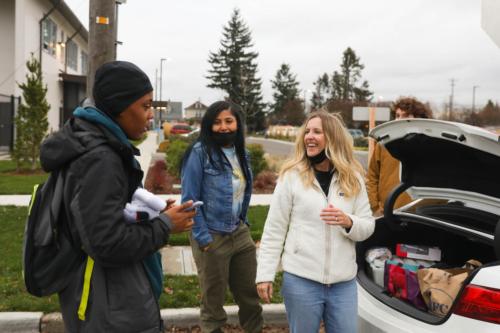 Coffee Oasis workers talk with former resident