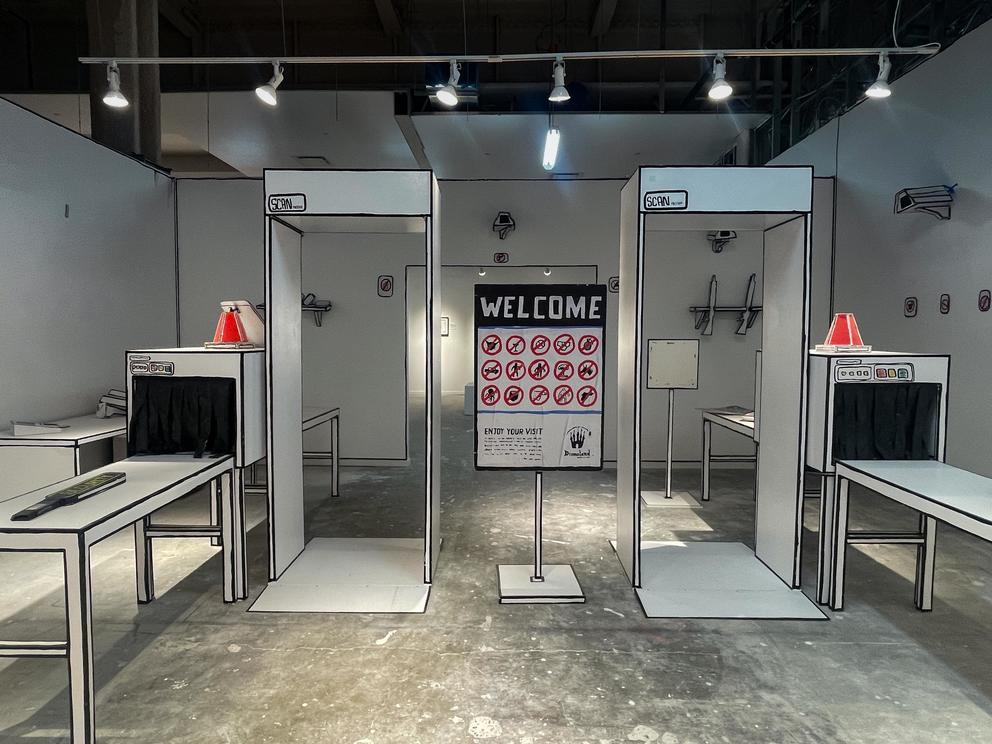 Cardboard TSA check point with luggage screen scanners and security cameras