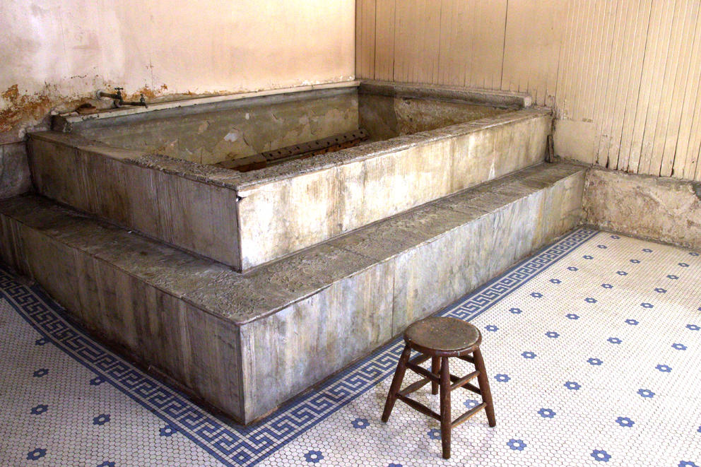 An abandoned bath is seen in almost perfect condition.