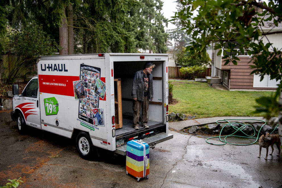 Mulkerin stands in the back of a U-haul truck