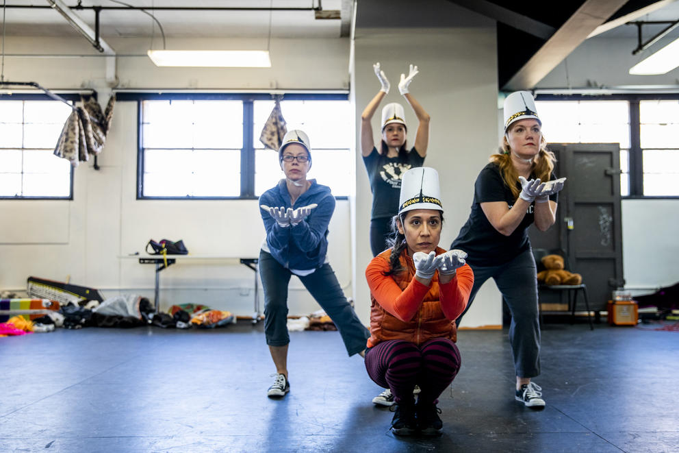 four dancers together in a pose