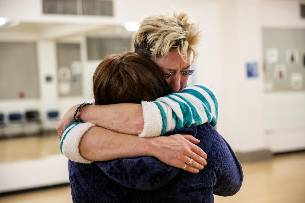 Hill and Lambert hug each other