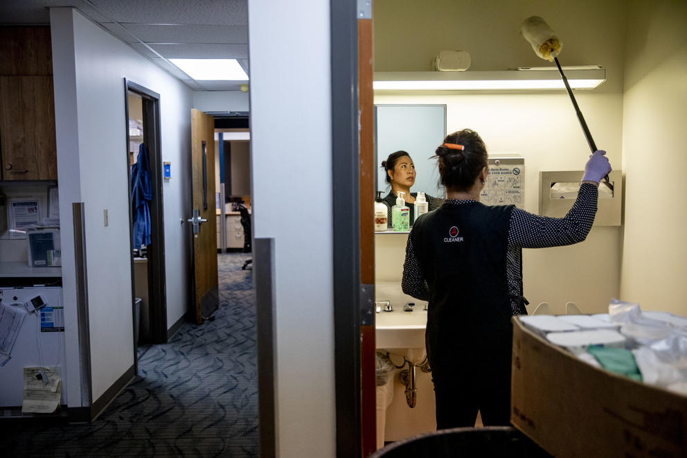 Nary cleans in a bathroom