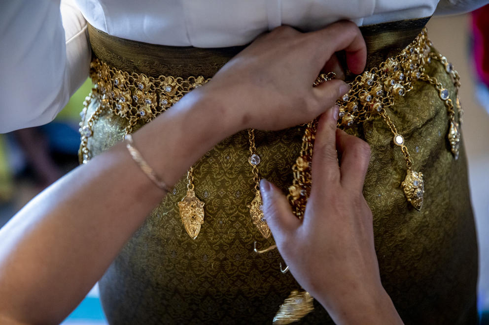 Nary's hands working on a skirt