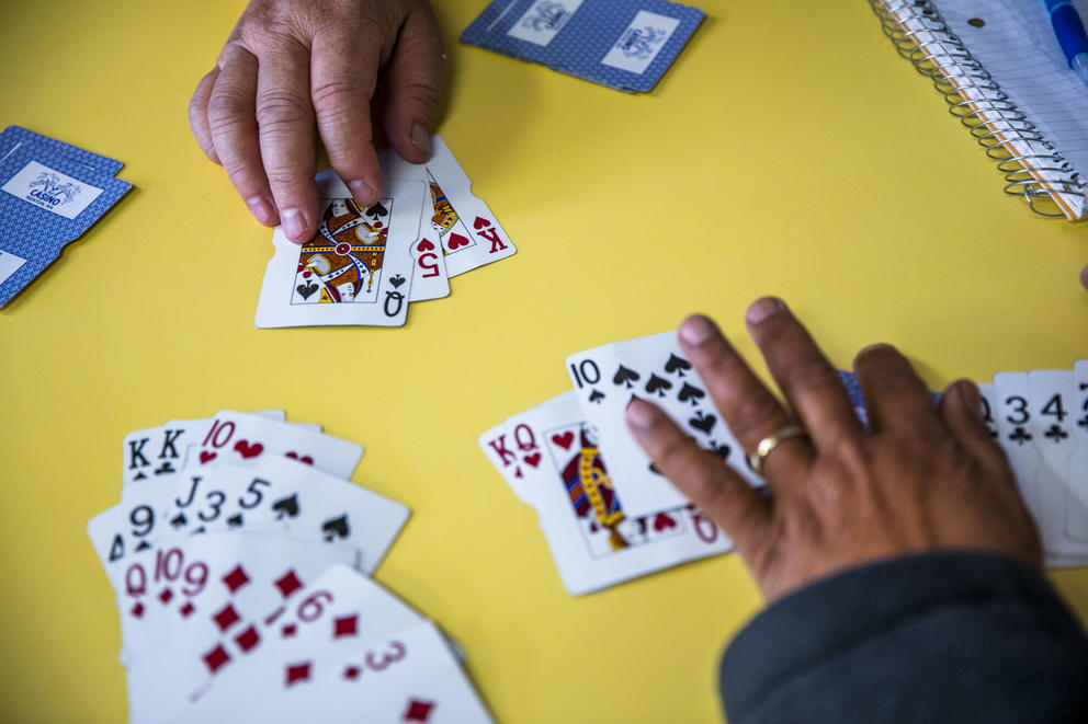 A table of regulars play a game of cards at King Donuts in Rainier Beach on Wednesday, Nov. 14, 2018. The group of mostly retired friends say they come to King Donuts almost every day.