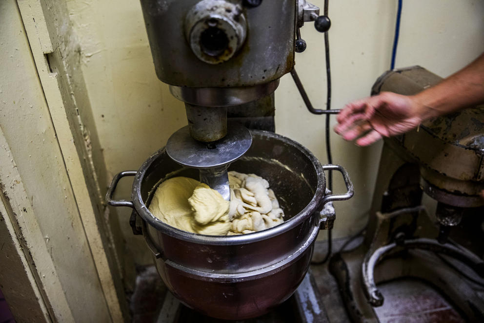 Travis Chhuor, 30, prepares doughnuts in the morning at King Donuts in Rainier Beach on Sunday, Nov. 18, 2018. The doughnuts are made in house in the morning and Chhuor is the sole baker. 