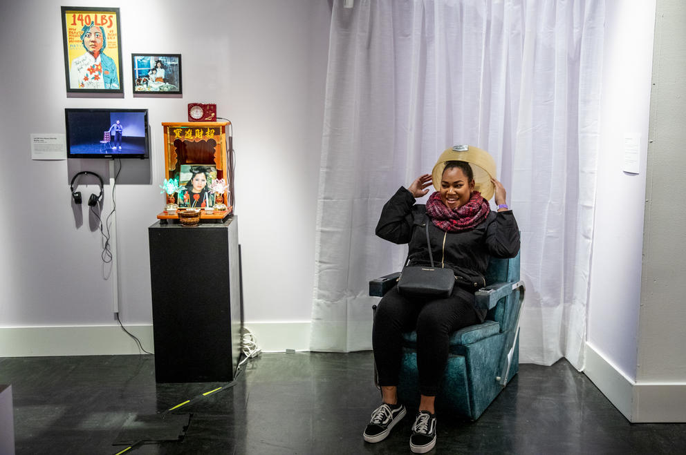 Mariama sits in a beauty chair