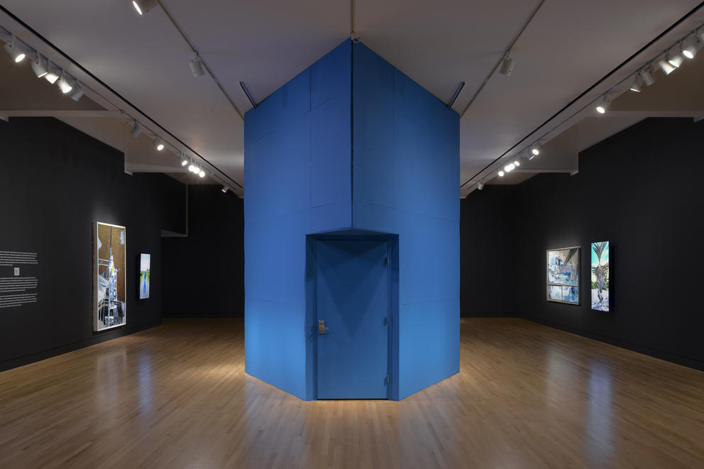 a large blue booth inside a gallery