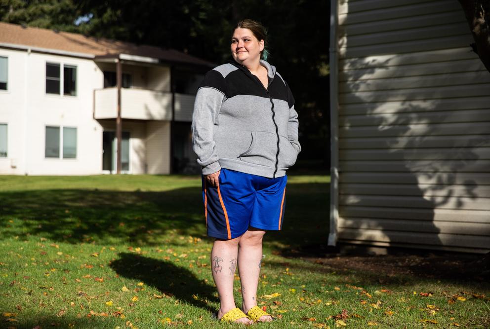 Maylor stands outside her home