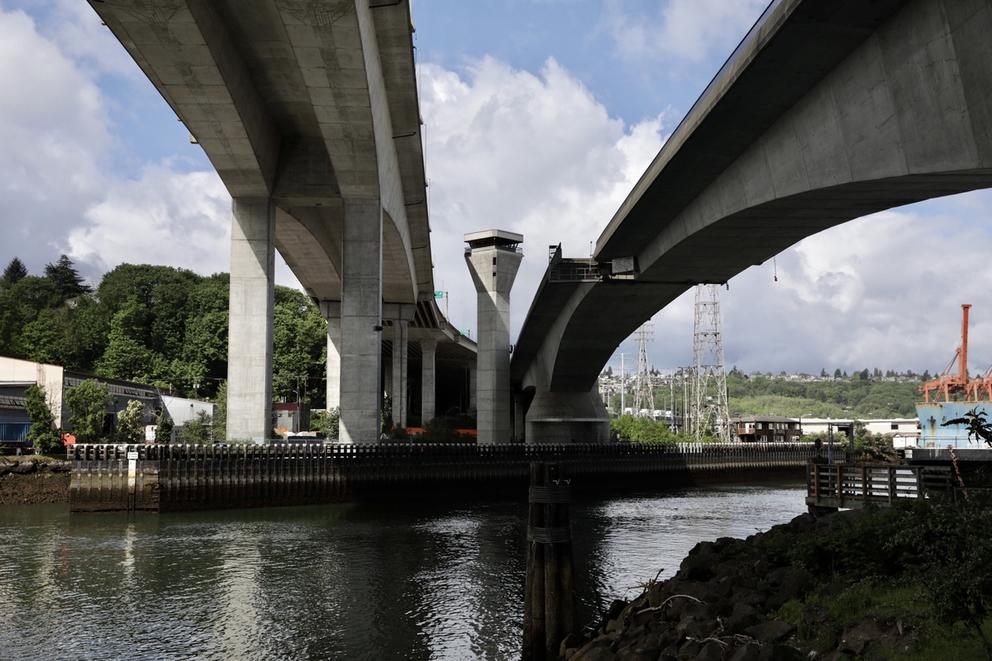 bridge with behind it blue sky with clouds