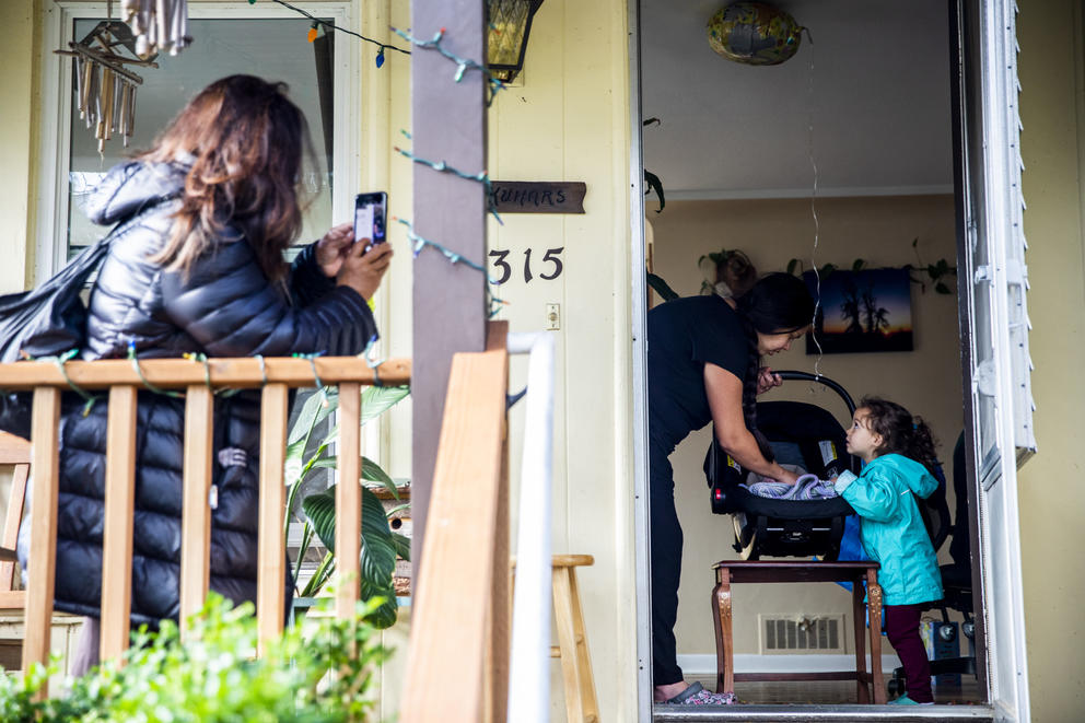 Jayshree takes photos from the porch