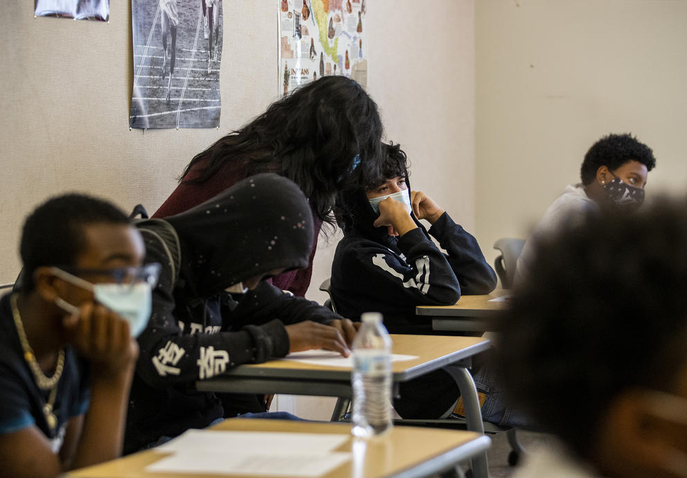 Students are pictured in a classroom