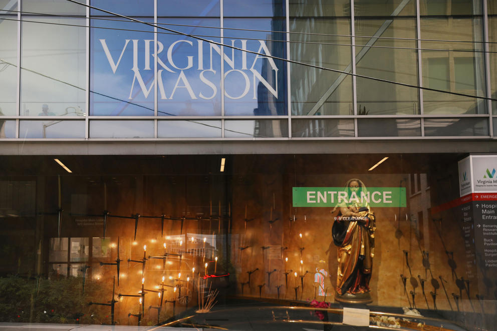 A multiple exposure image newly formed Virginia Mason Franciscan Health overlayed with details from Seattle’s St. James Cathedral