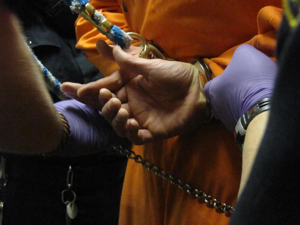 guards changing restraints on a prisoners in Walla Walla