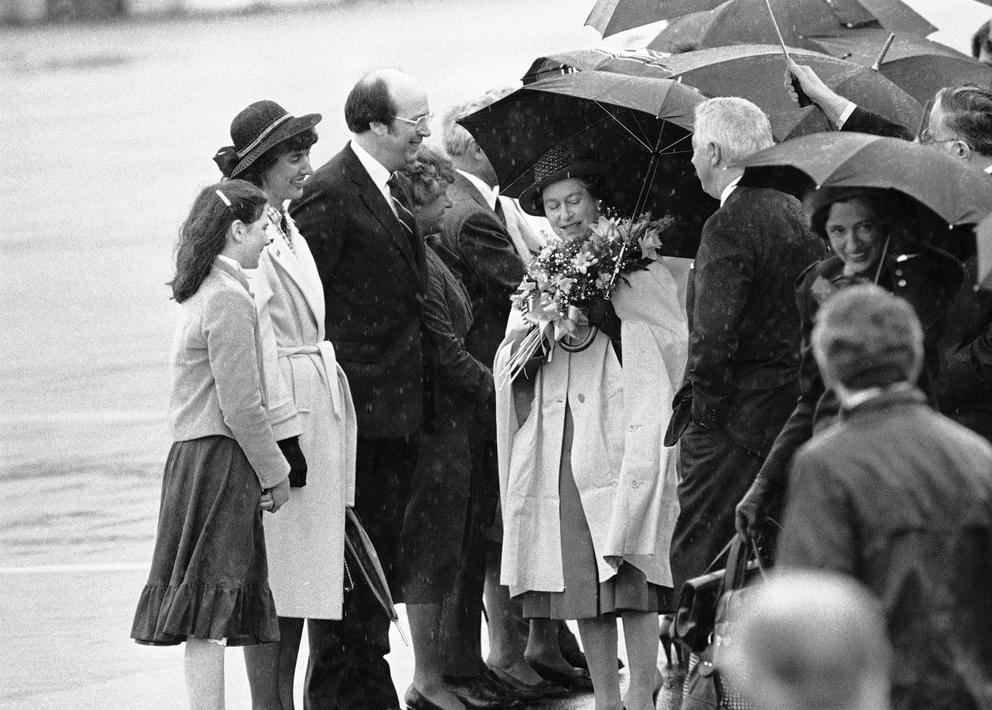 The queen holds a bouquet