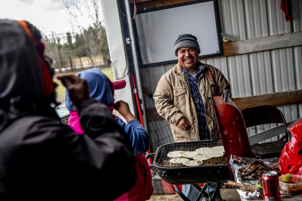 Ramon laughs at the grill