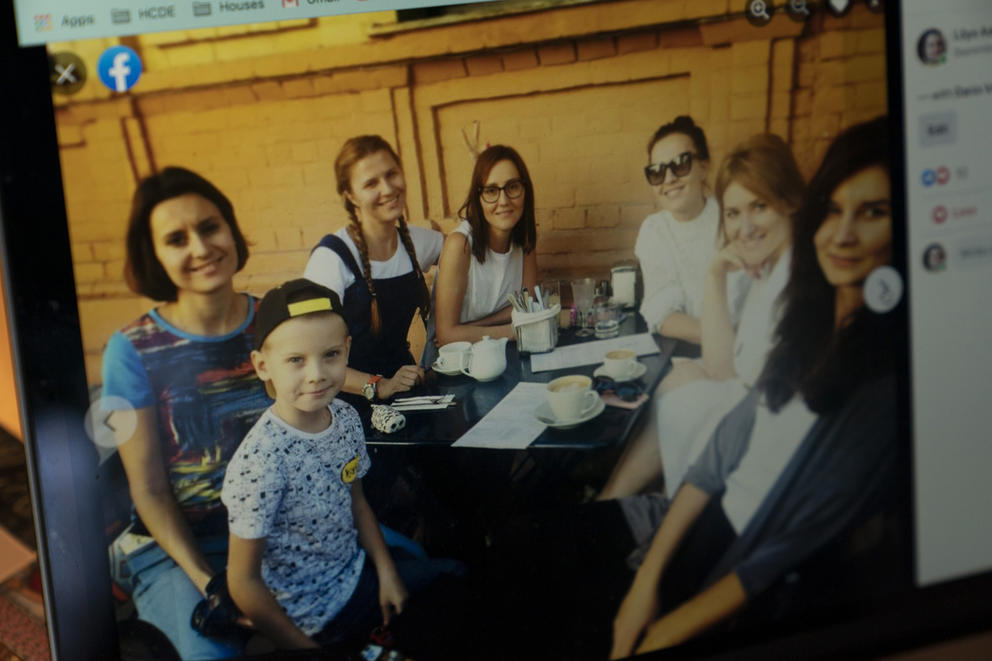 Liliya Askarova (top center) is seen with friends in a Facebook photo displayed on a computer