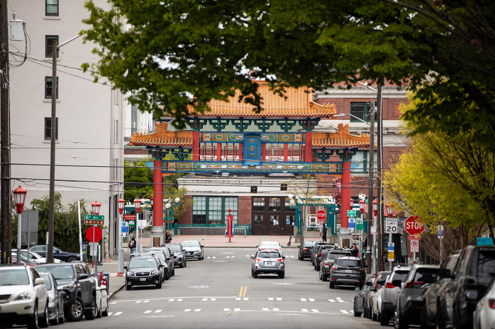 A view down a street with a Chinese style archway in the distance