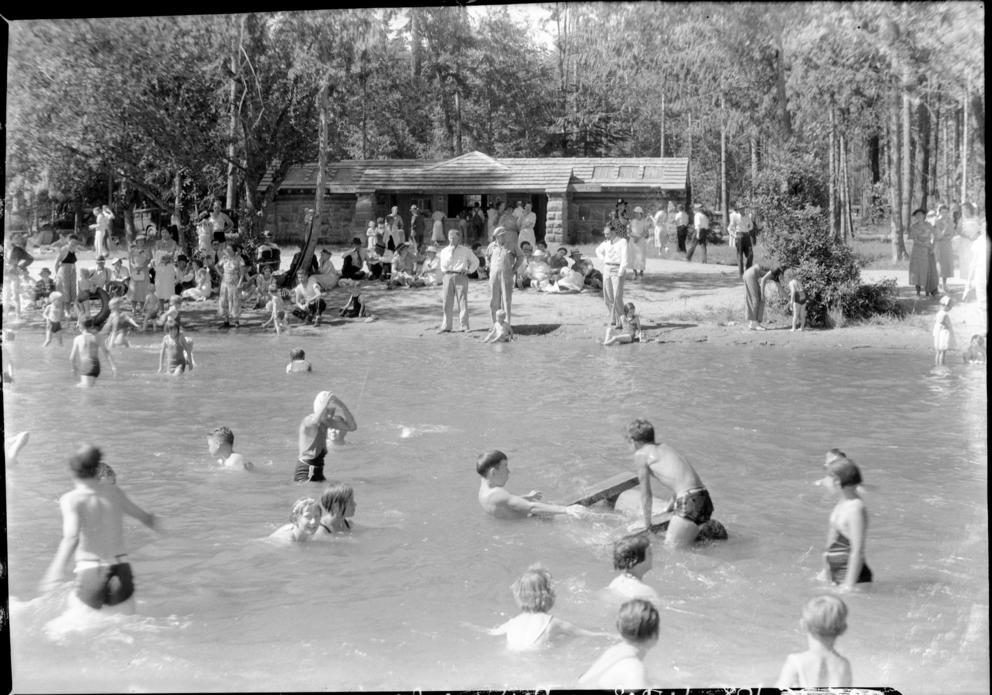 Many people in the water at a beach