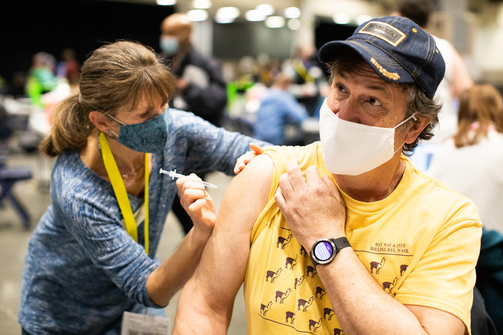 A picture of a person getting a COVID-19 vaccine shot in their arm.