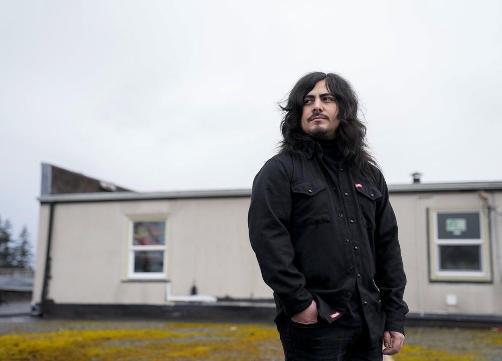 Santos Enrique Camara stands outside of his home in Marysville