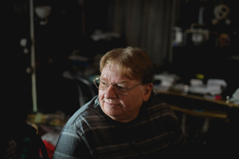 A close up of a woman's face lit by side window light