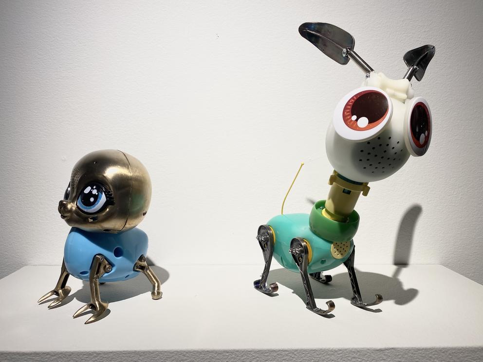 photo of two strange toys on display