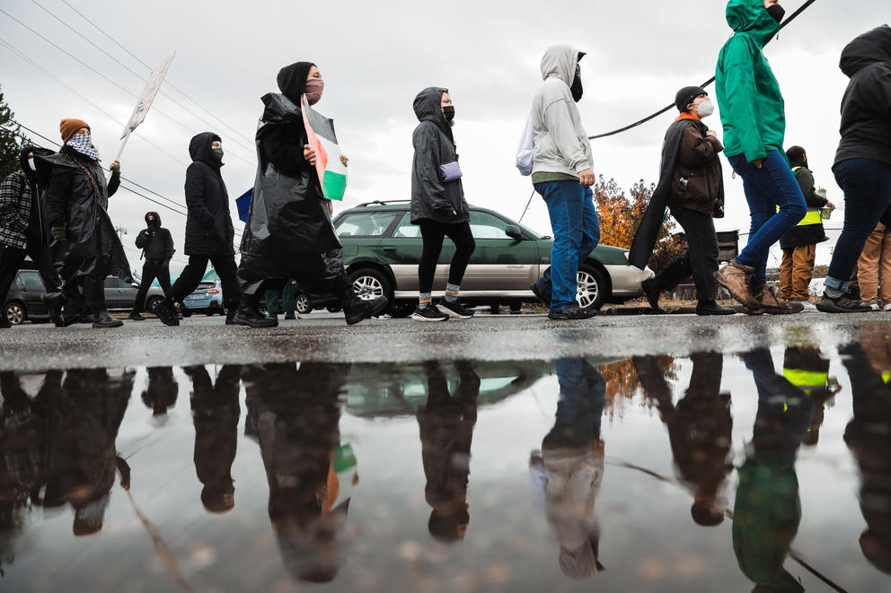 protesters walk around at the Port of Tacoma