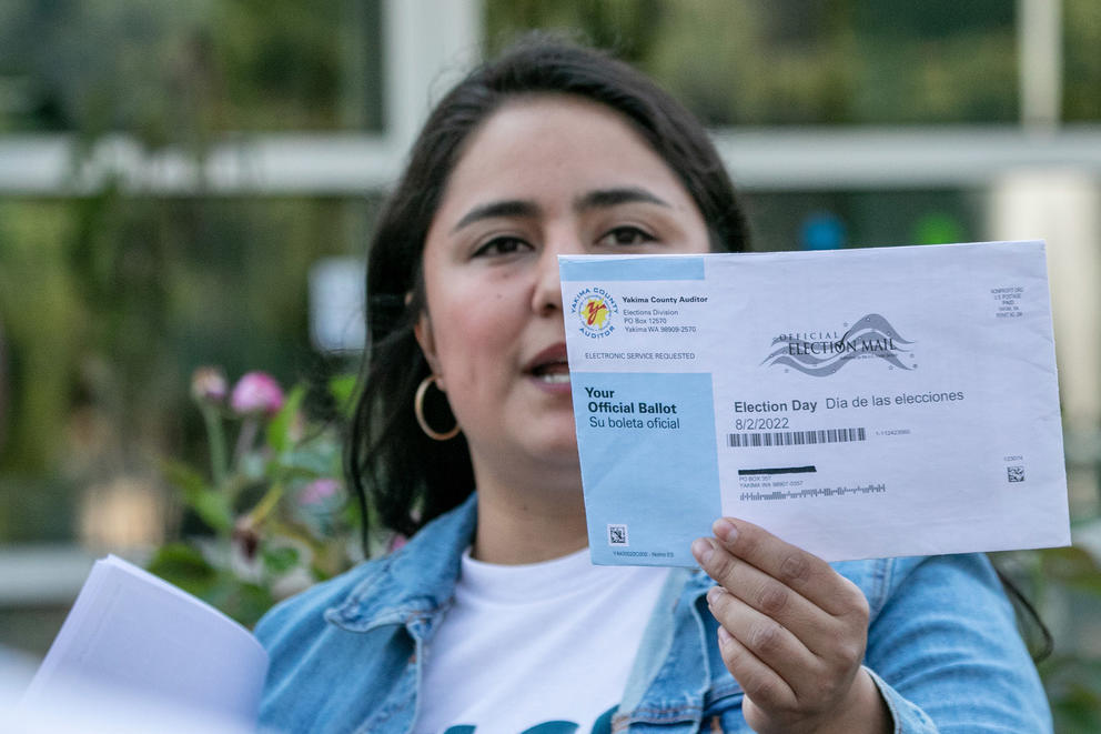 Dulce Gutierrez shows a mail-in ballot