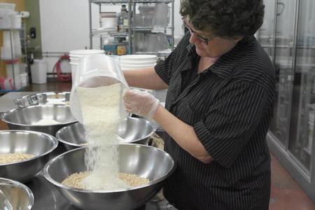 Karen Fischer preps a batch of granola