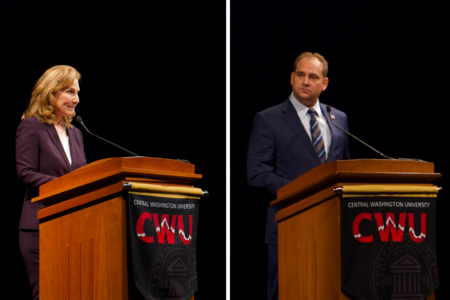 Kim Schrier and Matt Larkin stand behind podiums