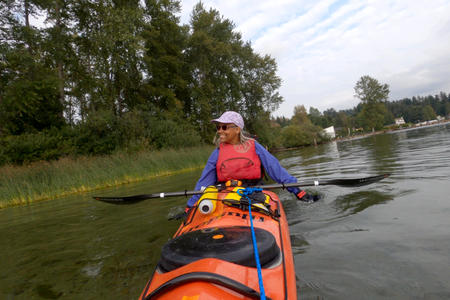 Woman in a kayak on the water