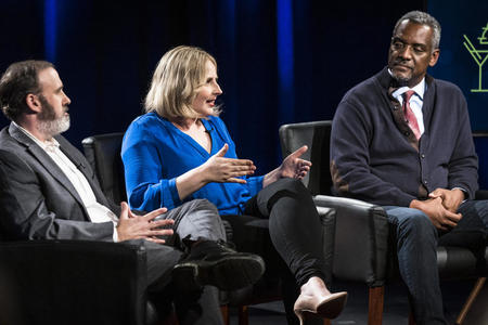 three people onstage