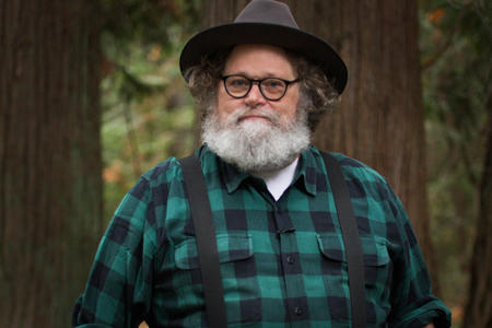 Knute Berger is seen in a forest.