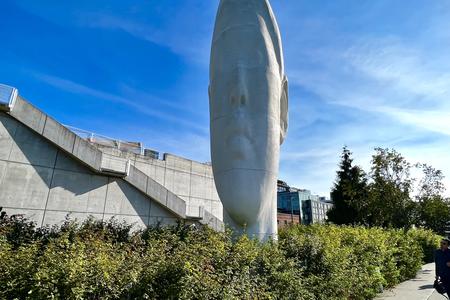 photo of a large white sculpture of a girl's face