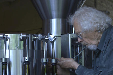 Alphonse de Klerk of Rolling Bay Winery starts up the bottle filler